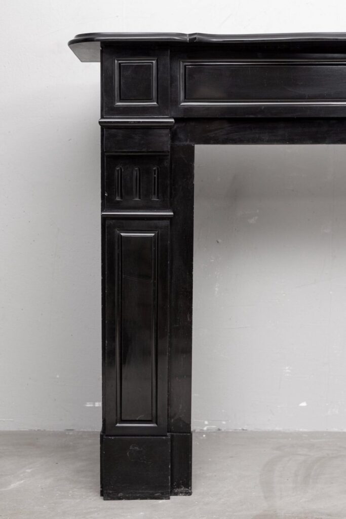 Set of two identical black marble fireplaces