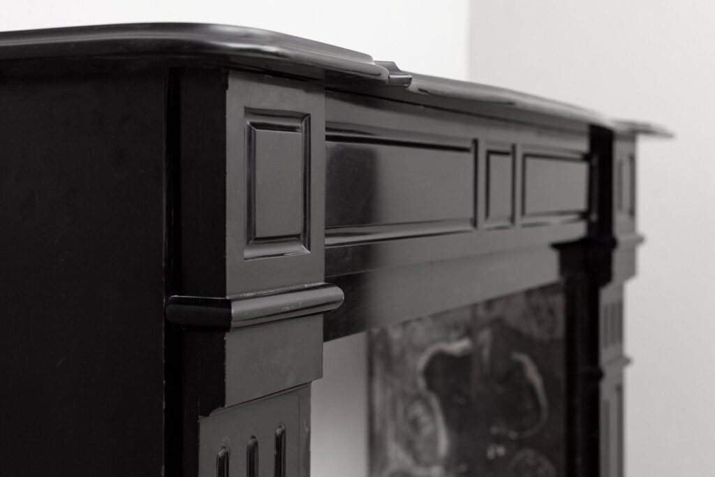 Set of two identical black marble fireplaces