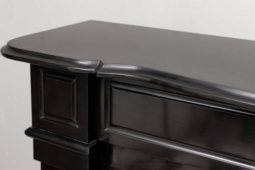 Set of two identical black marble fireplaces