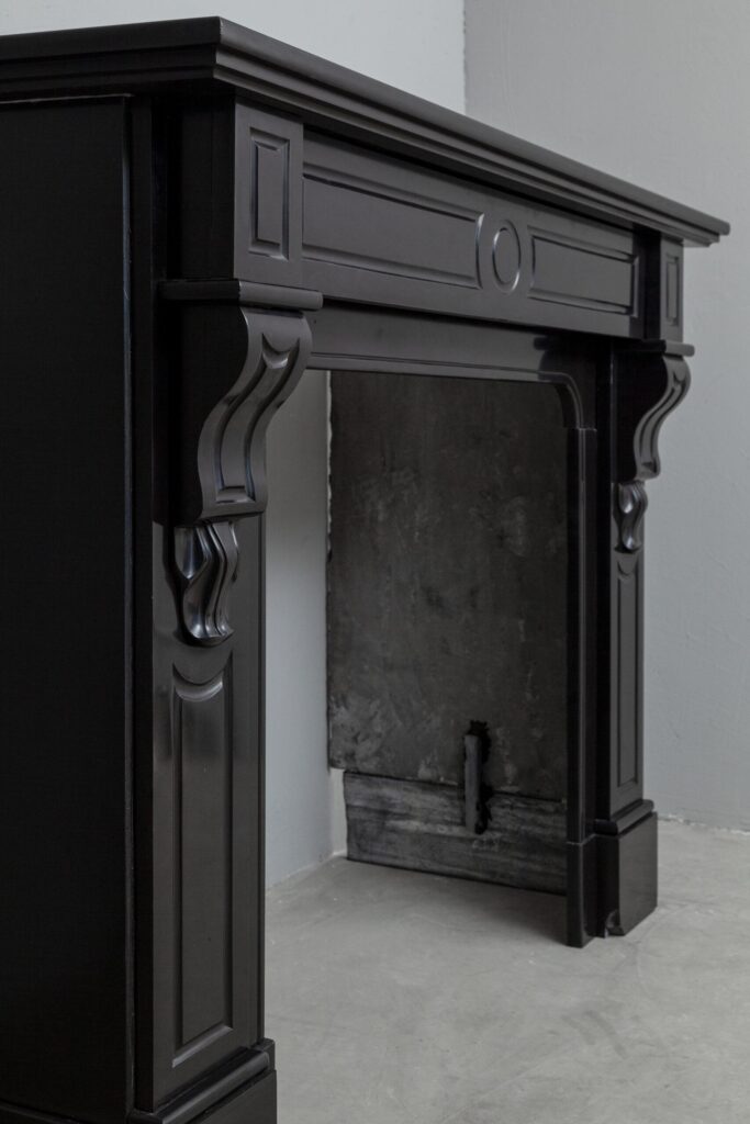 Set of two identical black marble fireplaces