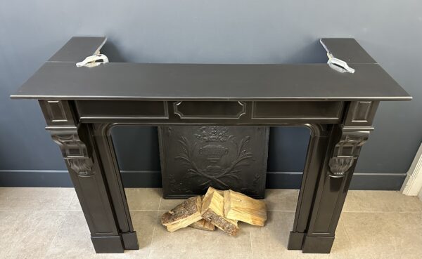 small antique black fireplace