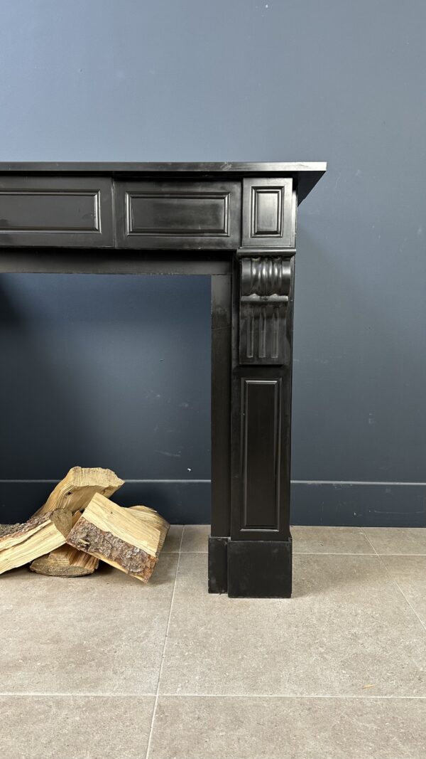 small antique black fireplace