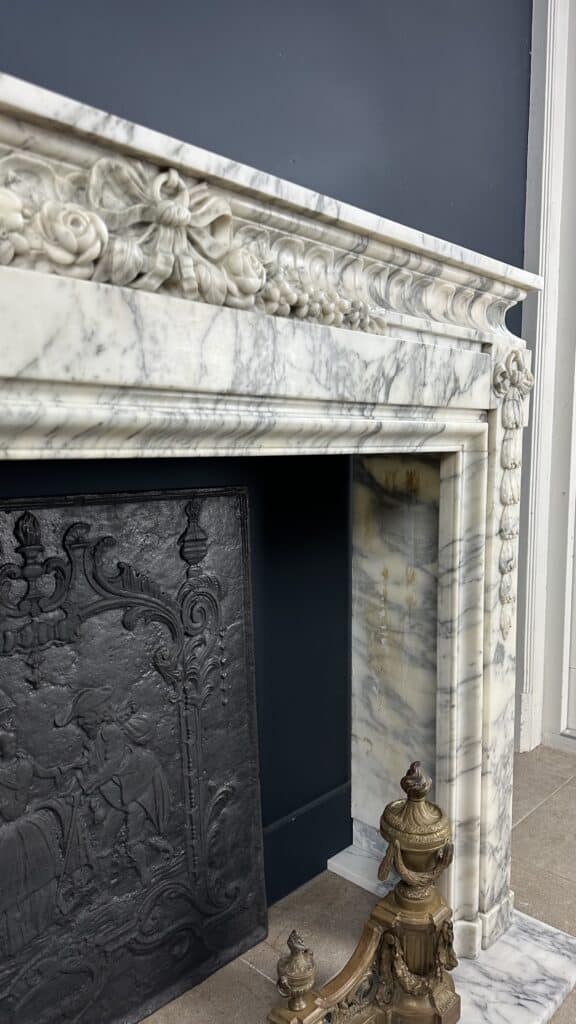 Beautiful Antique French Front Fireplace: A Masterpiece of Refinement and Craftsmanship