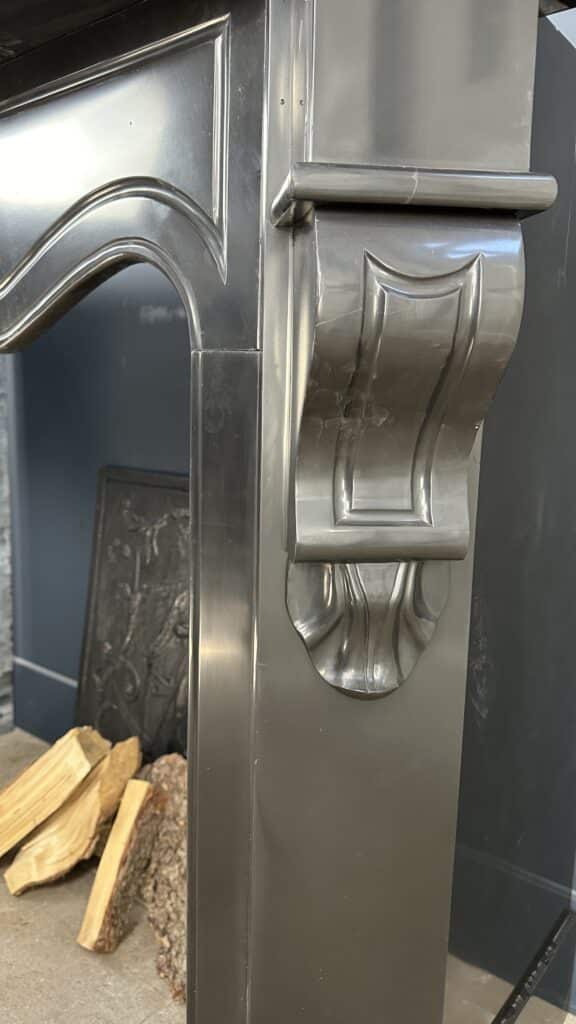 Antique Black Marble Fireplace with Angled Consoles