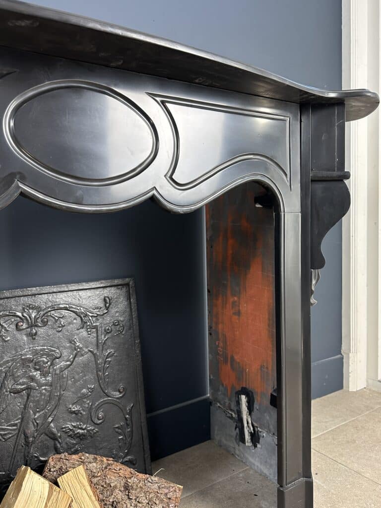 Antique Black Marble Fireplace with Angled Consoles