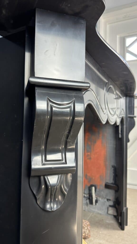 Antique Black Marble Fireplace with Angled Consoles