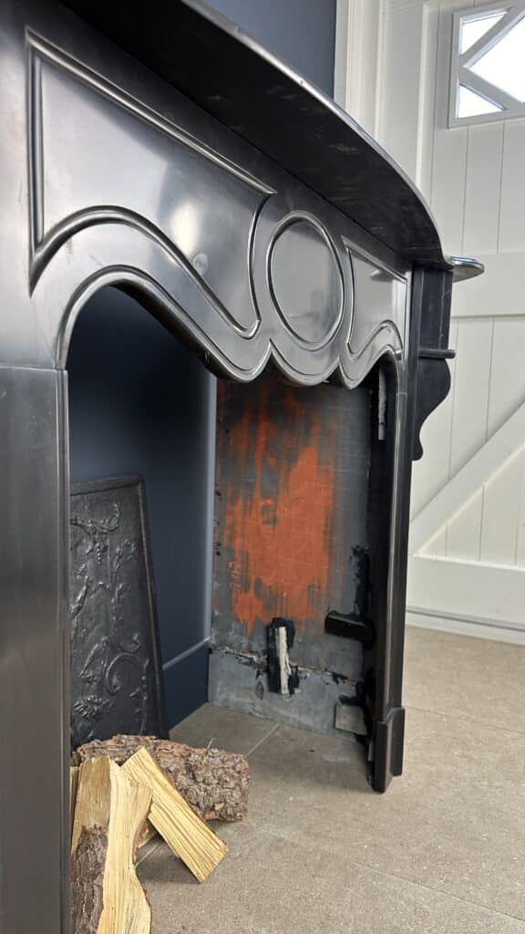 Antique Black Marble Fireplace with Angled Consoles