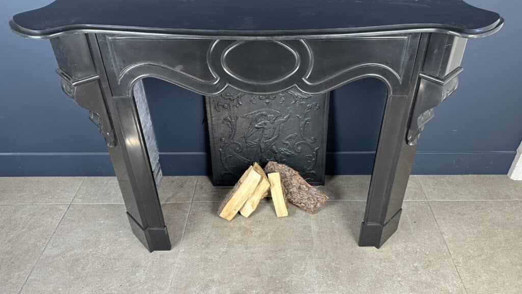 Antique Black Marble Fireplace with Angled Consoles
