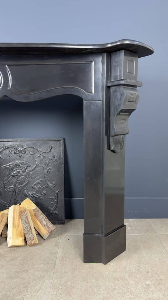 Antique Black Marble Fireplace with Angled Consoles