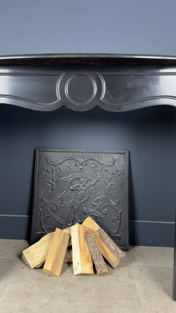 Antique Black Marble Fireplace with Angled Consoles