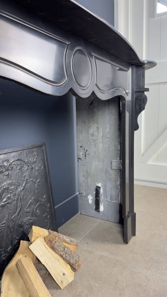 Antique Black Marble Fireplace with Angled Consoles