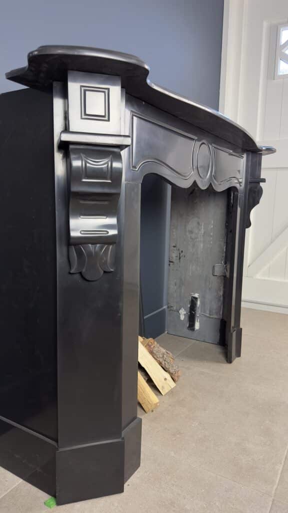 Antique Black Marble Fireplace with Angled Consoles
