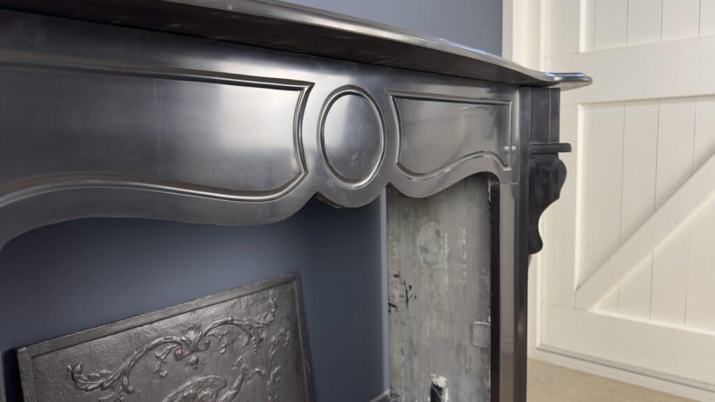 Antique Black Marble Fireplace with Angled Consoles