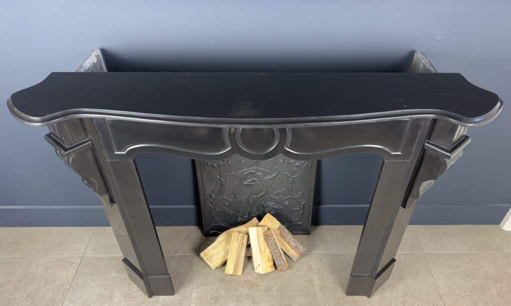 Antique Black Marble Fireplace with Angled Consoles
