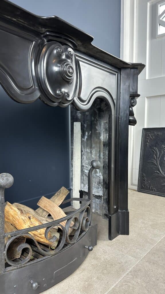 Distinctive Antique Black Circular Fireplace with Unique Front