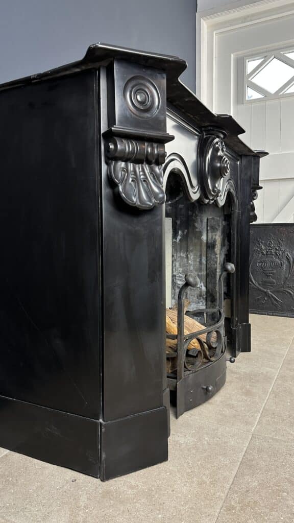 Distinctive Antique Black Circular Fireplace with Unique Front