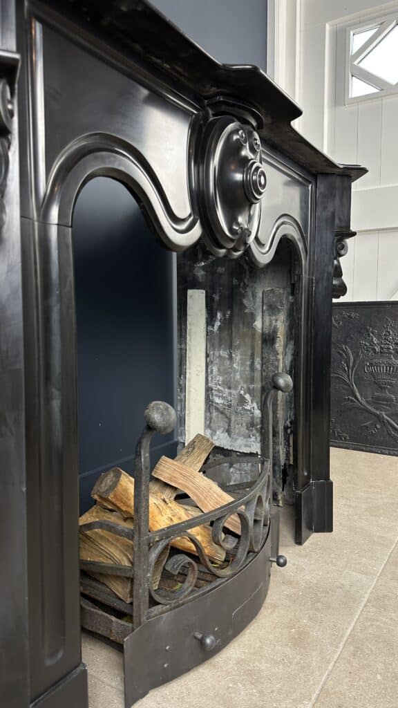 Distinctive Antique Black Circular Fireplace with Unique Front