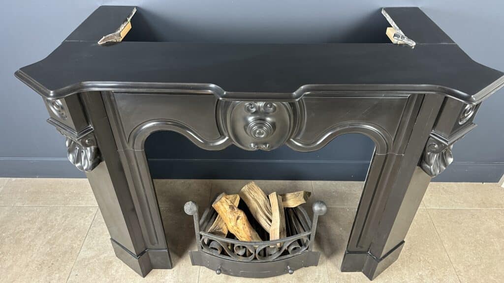 Distinctive Antique Black Circular Fireplace with Unique Front