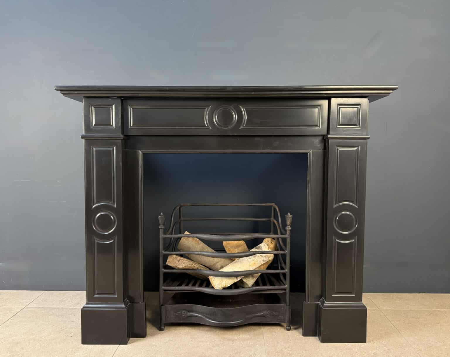 Sleek Black Circular Fireplace with Geometric Front