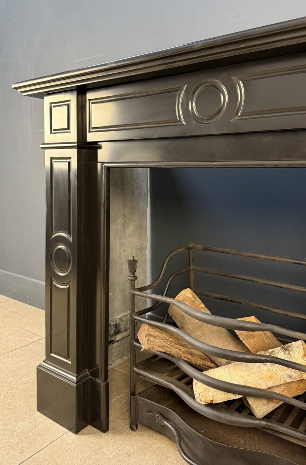 Sleek Black Circular Fireplace with Geometric Front — detail 2