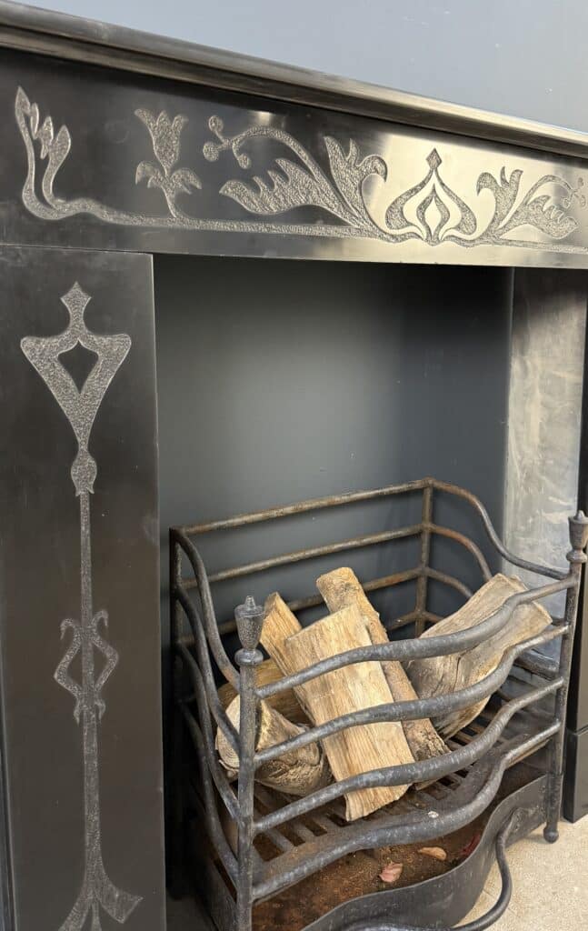 Etched Front Fireplace in Noir de Mazy Marble