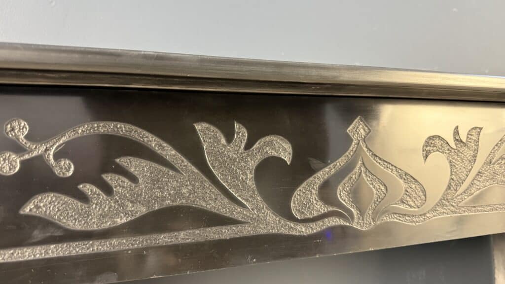 Etched Front Fireplace in Noir de Mazy Marble