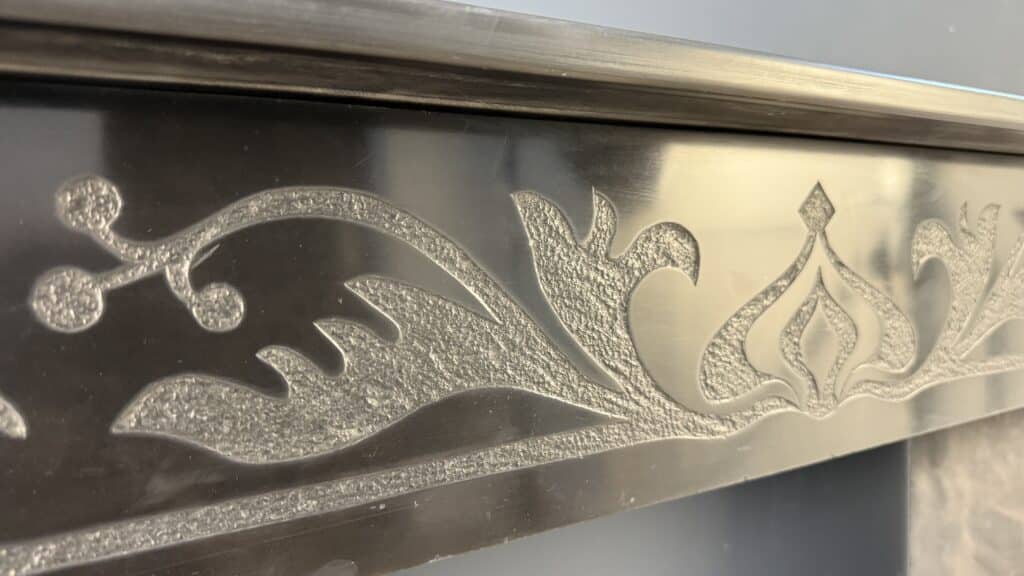 Etched Front Fireplace in Noir de Mazy Marble