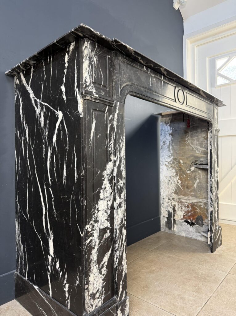 Sleek Antique Circular Fireplace in Nero Marquina Marble